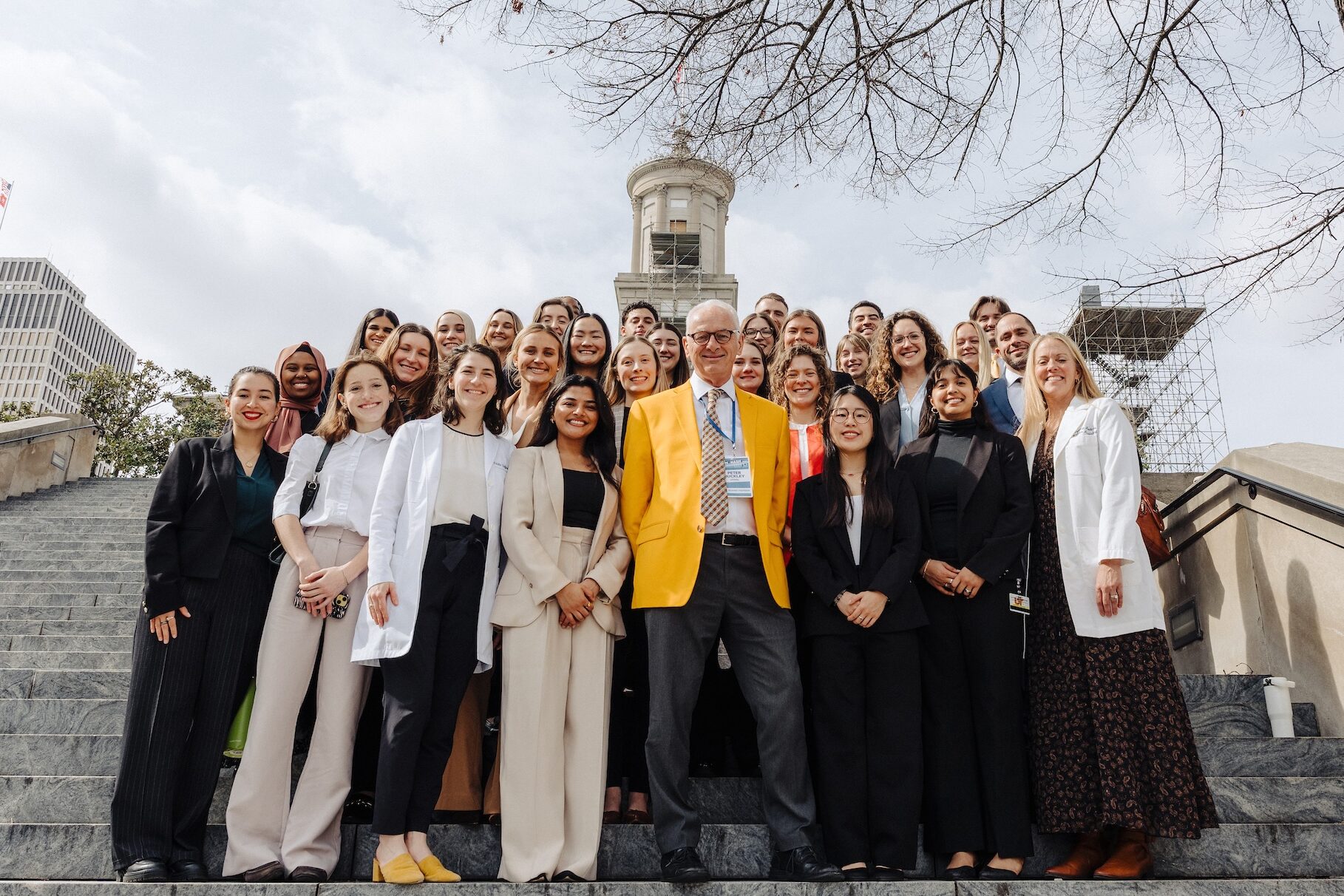 UT Health Sciences PA students pose for a group photo with Chancellor Peter Buckley in front of the Capitol Building.
