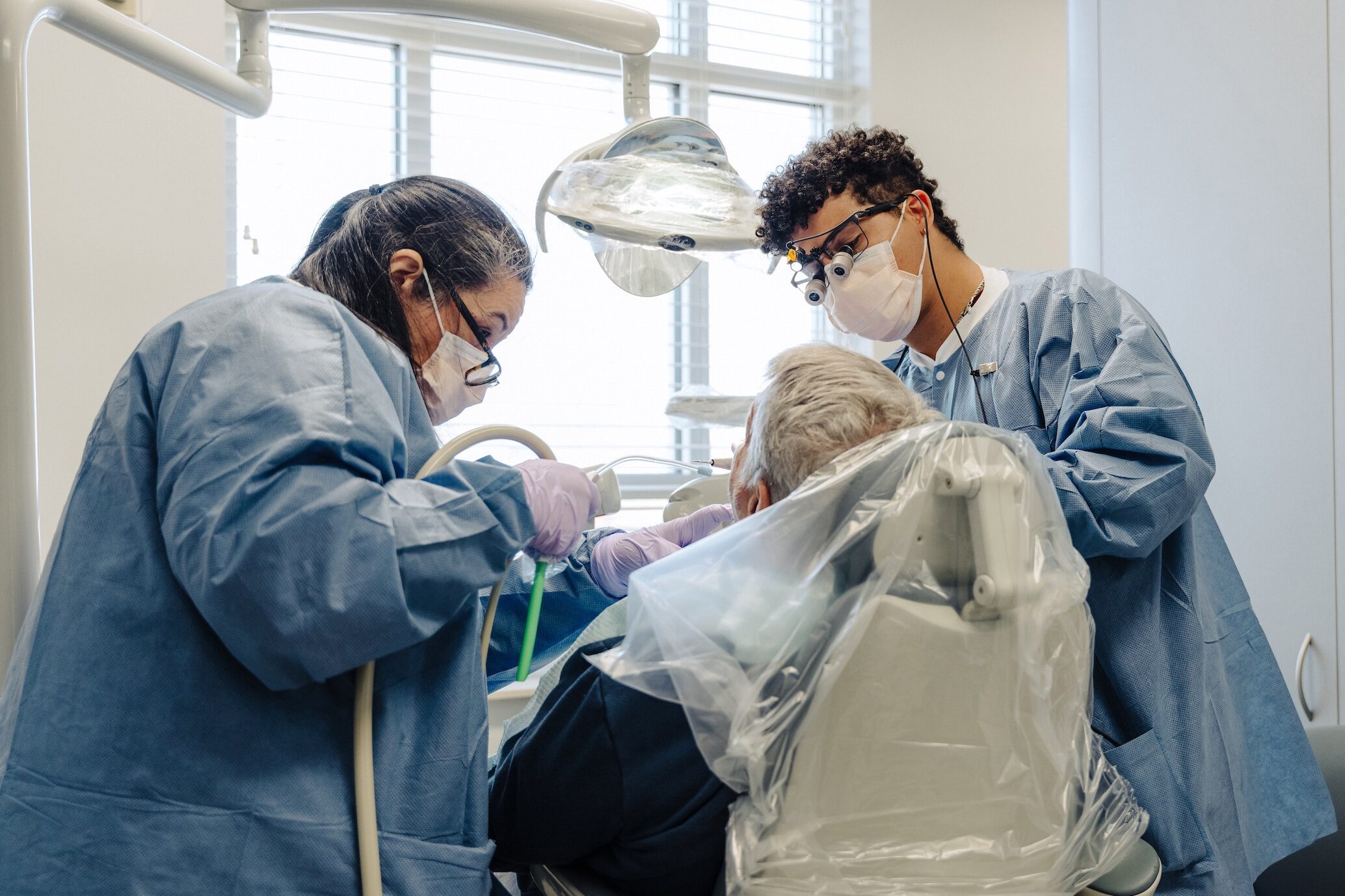 Dental student Gustavo Morrice working with a patient.