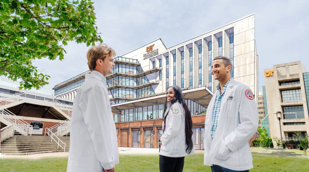 College of Medicine students stand in front of the future site of the College of Medicine Interdisciplinary Building, with a rendering of the building in the background.
