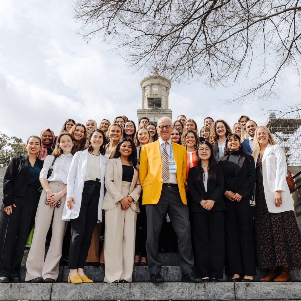 A group of PA students and Chancellor Peter Buckley pose on the steps of the Tennessee Capitol.