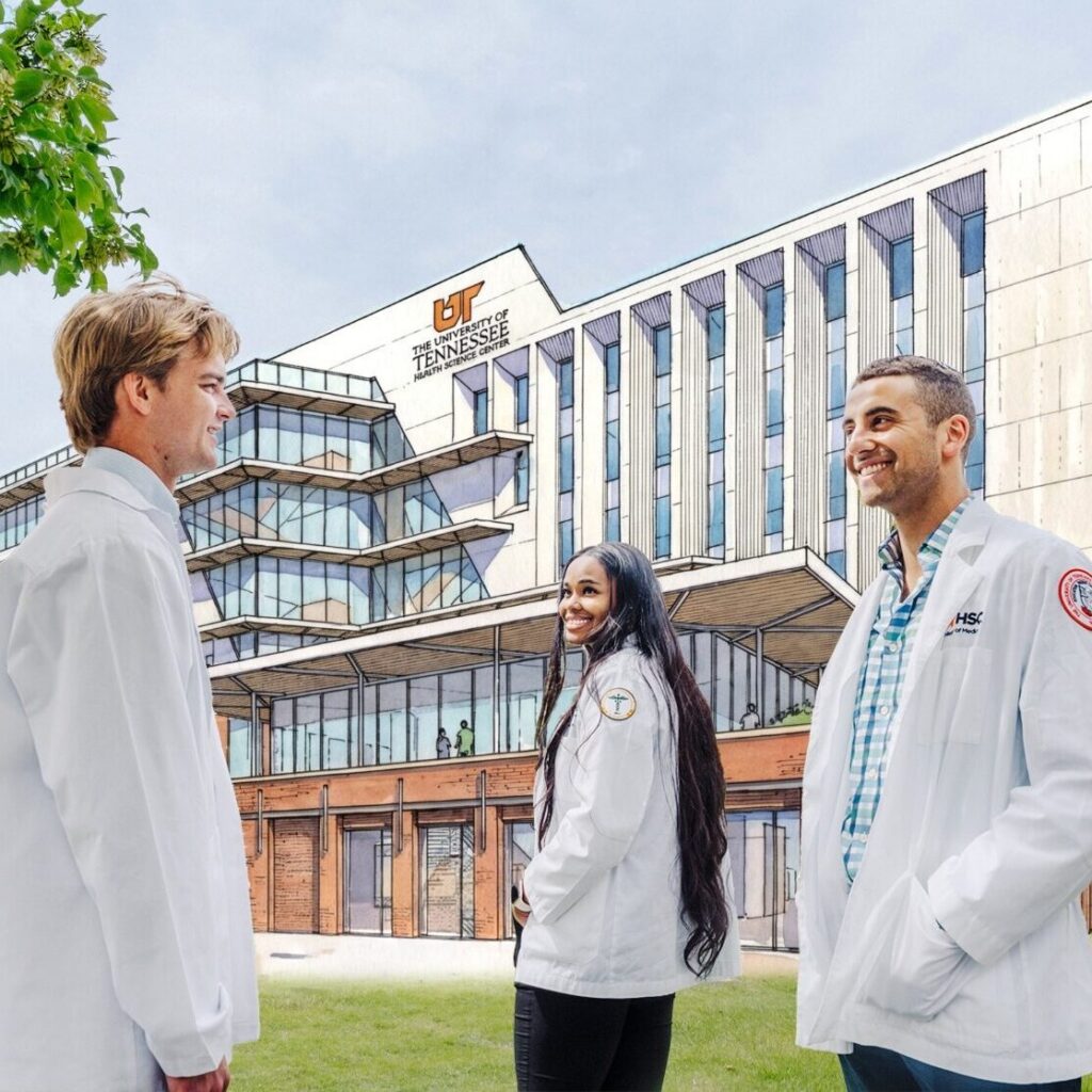College of Medicine students stand in front of the future site of the College of Medicine Interdisciplinary Building, with a rendering of the building in the background.
